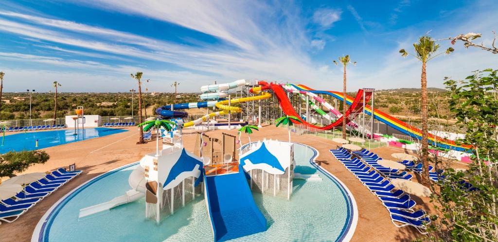 a large water park with a water slide at Globales Bouganvilla in Sa Coma