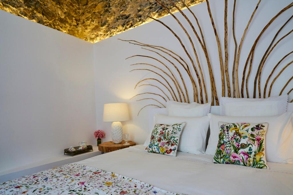 a bedroom with a bed with white sheets and pillows at Sparrow Sintra Nest in Sintra