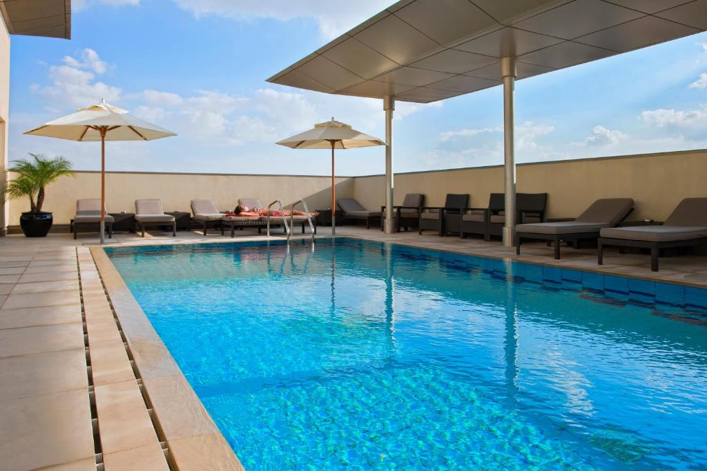 The swimming pool at or close to Centro Al Manhal by Rotana