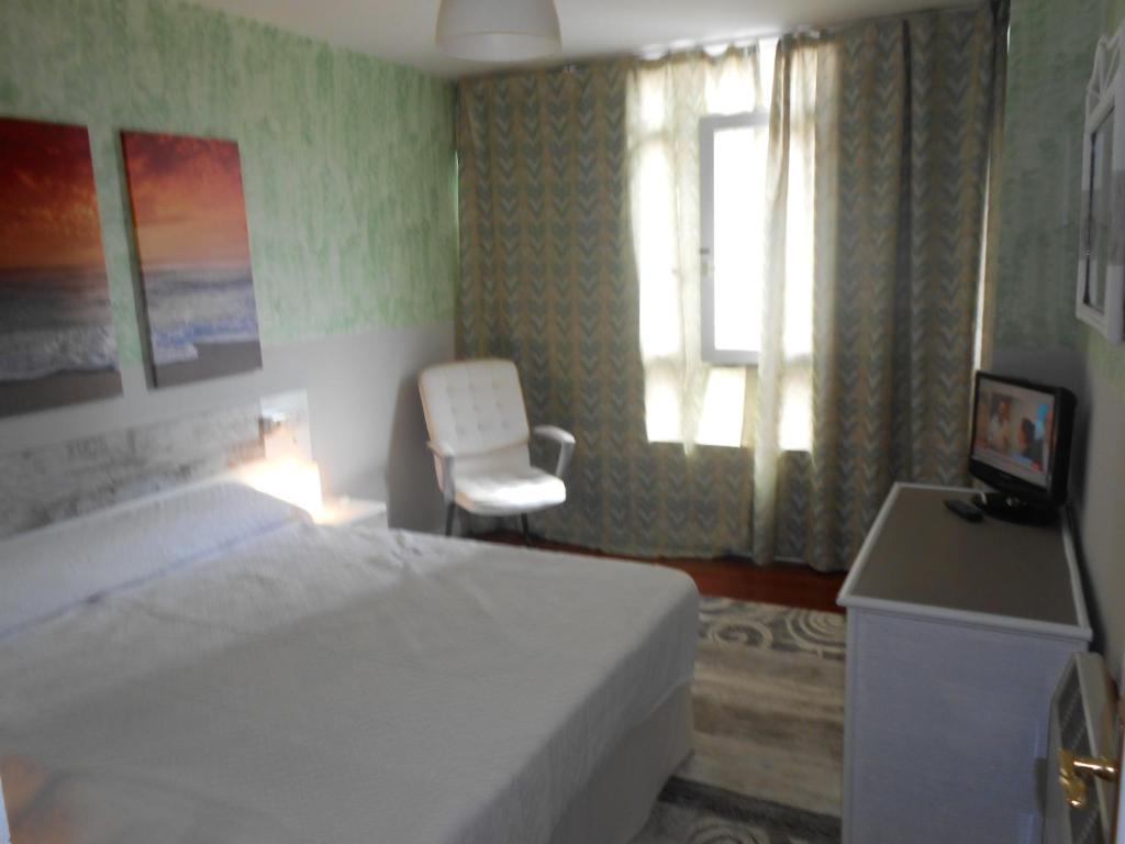 A bed or beds in a room at Hotel Canton