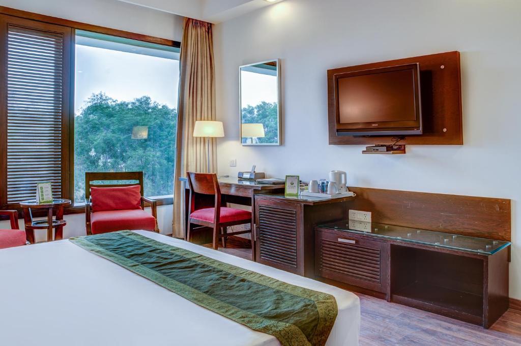 Postel nebo postele na pokoji v ubytování Amber Inn by Orion Hotels