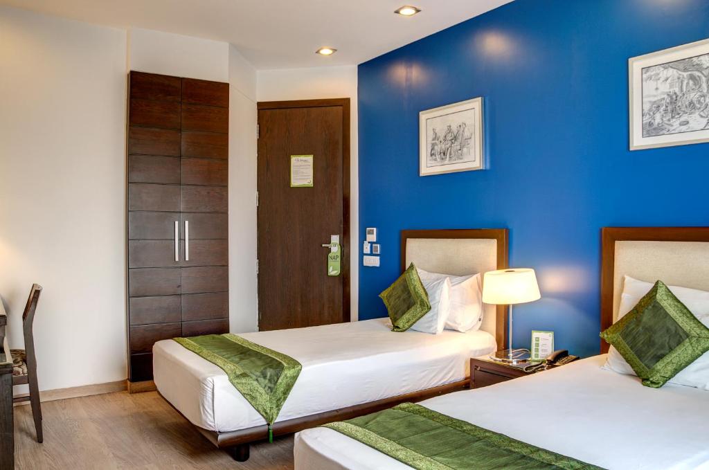 Postel nebo postele na pokoji v ubytování Amber Inn by Orion Hotels
