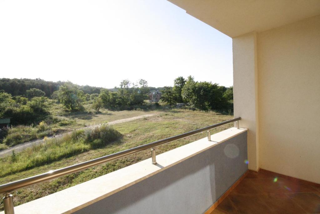 a balcony with a view of a field at Hotel Marant in Sozopol