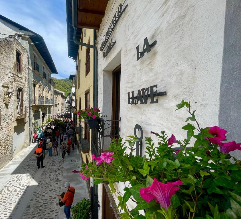 a group of people walking down a street at Casa Rural La Llave in Villafranca del Bierzo