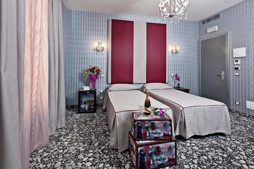 Postel nebo postele na pokoji v ubytování Hotel Relais Dei Papi