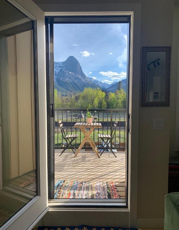 a sliding glass door with a view of a patio at Casa de Luna by Canadian Rockies Vacation Rentals in Canmore