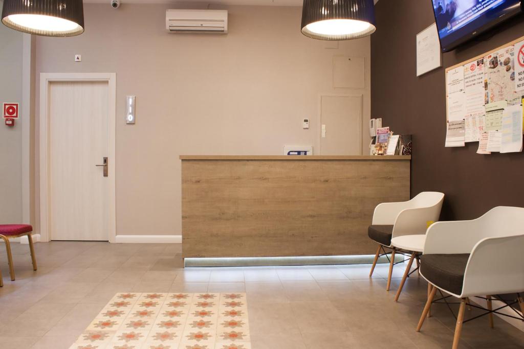 TV a/nebo společenská místnost v ubytování Plaza Goya Rooms