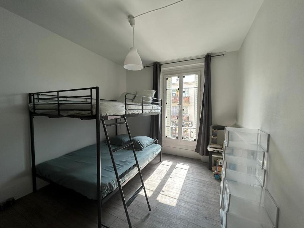 Ένα ή περισσότερα κρεβάτια σε δωμάτιο στο Appartement lumineux et spacieux avec 2 chambres