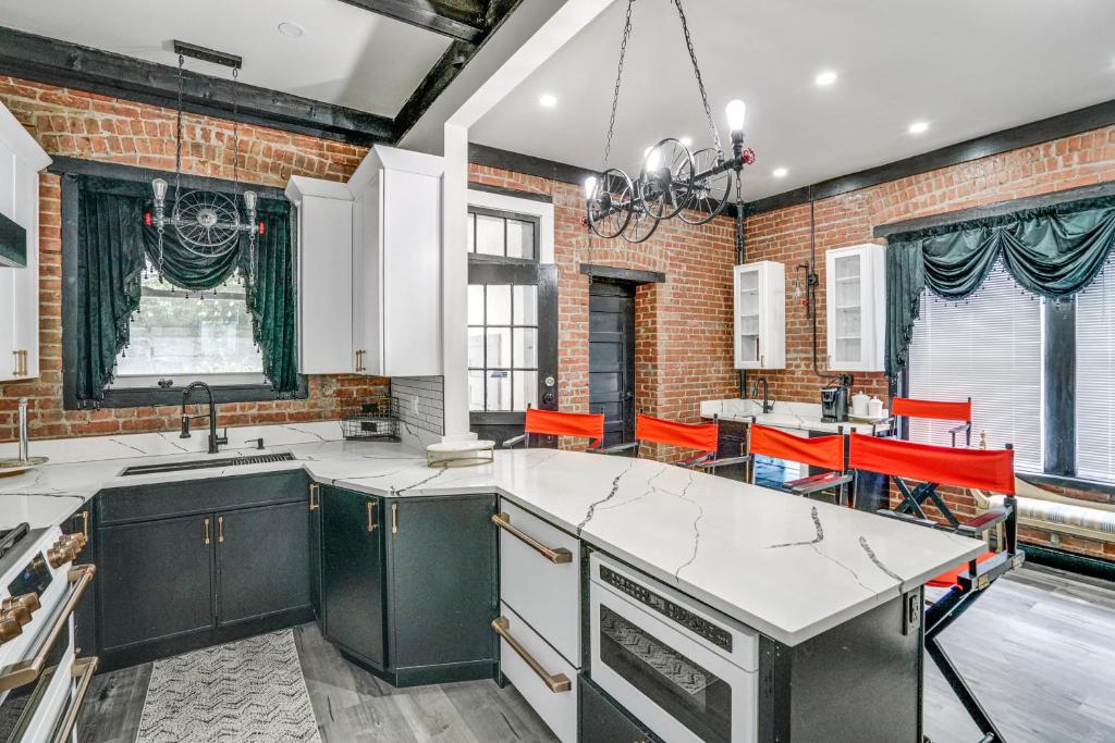 a kitchen with a brick wall at Walk to Nott Memorial Studious Retreat Near Eats in Schenectady