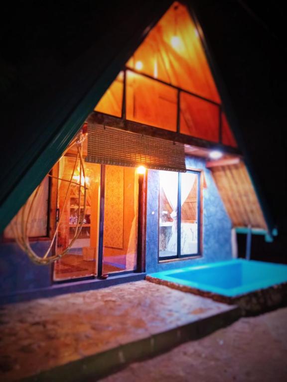 a view of a house with a swimming pool at Ella Shia Cabana in Badulla