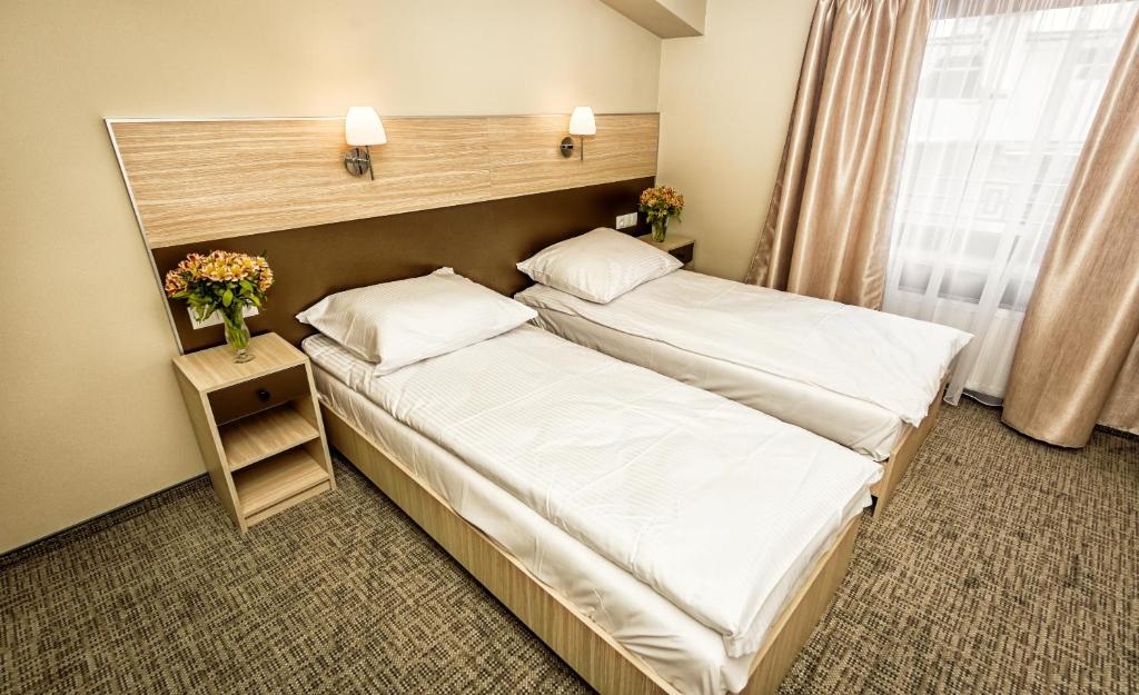 Posteľ alebo postele v izbe v ubytovaní Hotel Kazimierz III