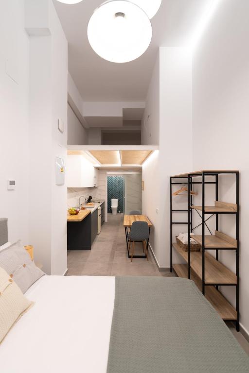 a bedroom with a bed and a desk in a room at Baélia Experience Hotel boutique in Alicante