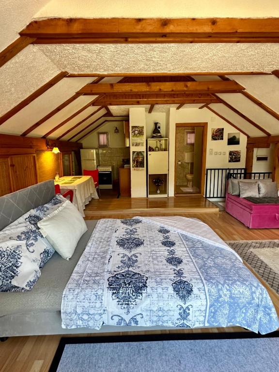 a bedroom with a large bed in a room at Studio Palma in Zvornik