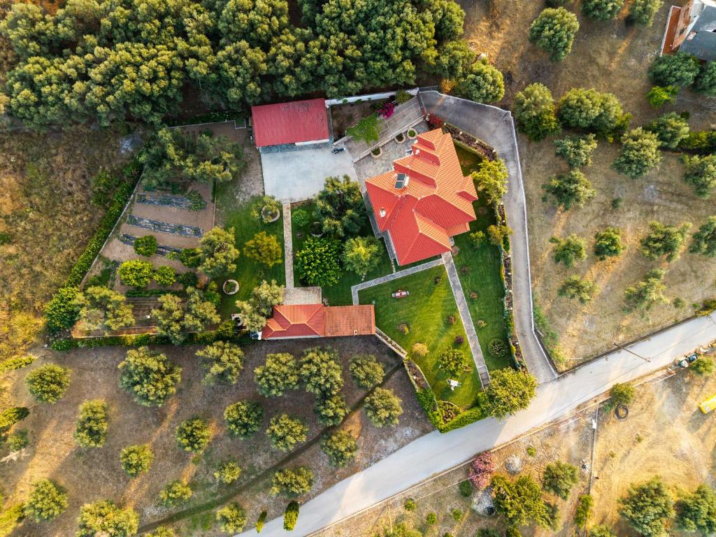 an overhead view of a house with a red roof at Georgias paradise villa and Garden in Kamárai