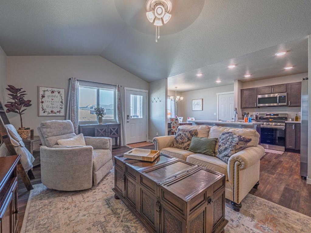 a living room with a couch and chairs and a table at Isaac's Nook in the Hills in Rapid City