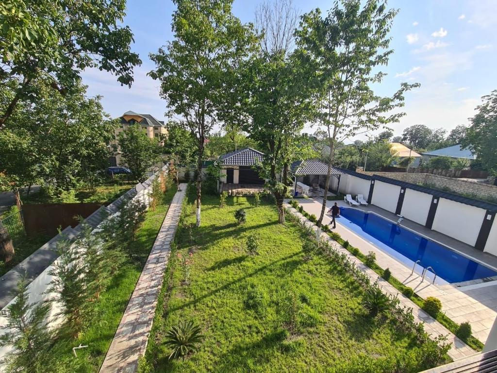 an overhead view of a garden with trees and a pool at Luxury villa Gabala ELM in Gabala