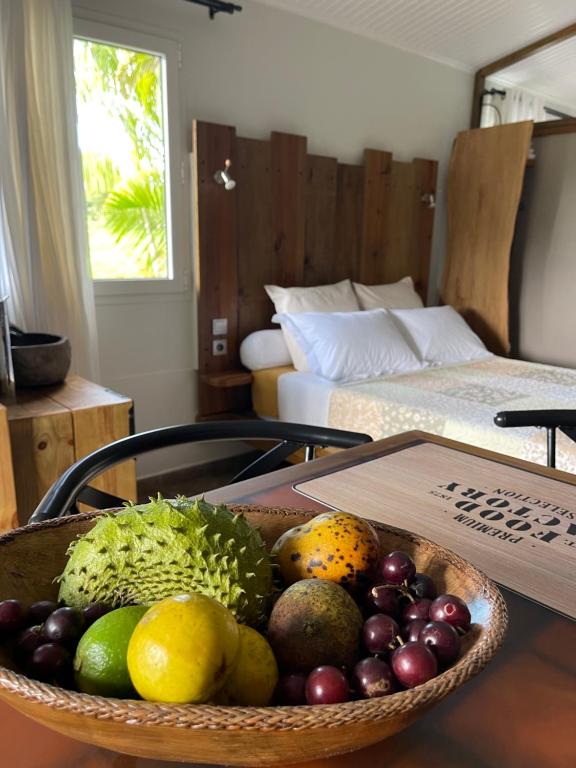 En eller flere senge i et værelse på Le petit Nénuphar