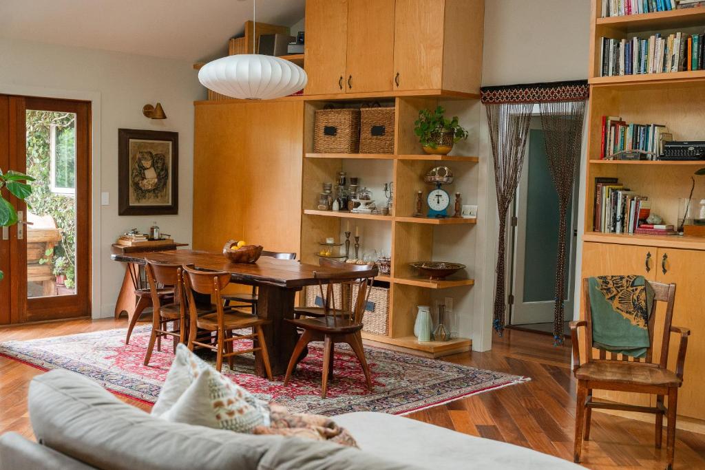 a living room with a table and a dining room at Casa Superba - Peaceful Sanctuary in Venice in Los Angeles