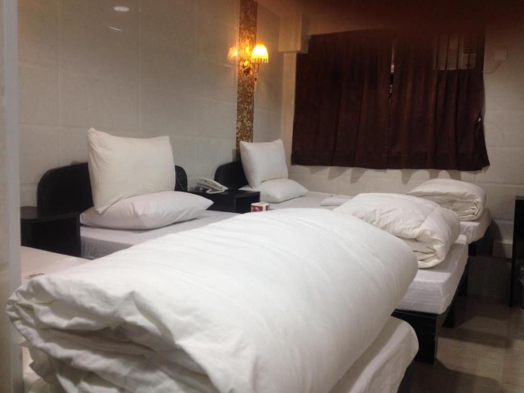 Postel nebo postele na pokoji v ubytování Manhattan Guesthouse