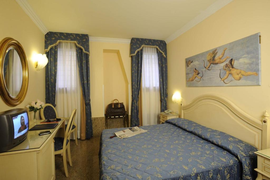 Voodi või voodid majutusasutuse Hotel Ca' Formenta toas