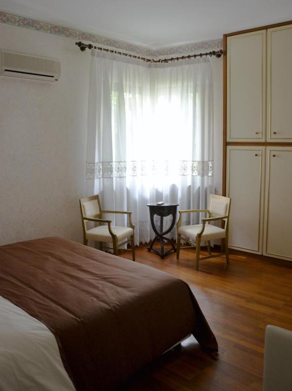 Postel nebo postele na pokoji v ubytování La Casa di Enrico