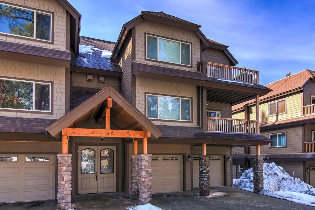 a house with a garage in front of it at Tahoe Woods Heavenly - Walk to beach & Gondola to Heavenly Ski in South Lake Tahoe