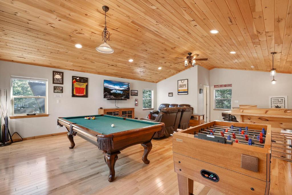 a living room with a pool table in it at Tahoe Frost - Air conditioned 4 bedroom Tahoe home in South Lake Tahoe