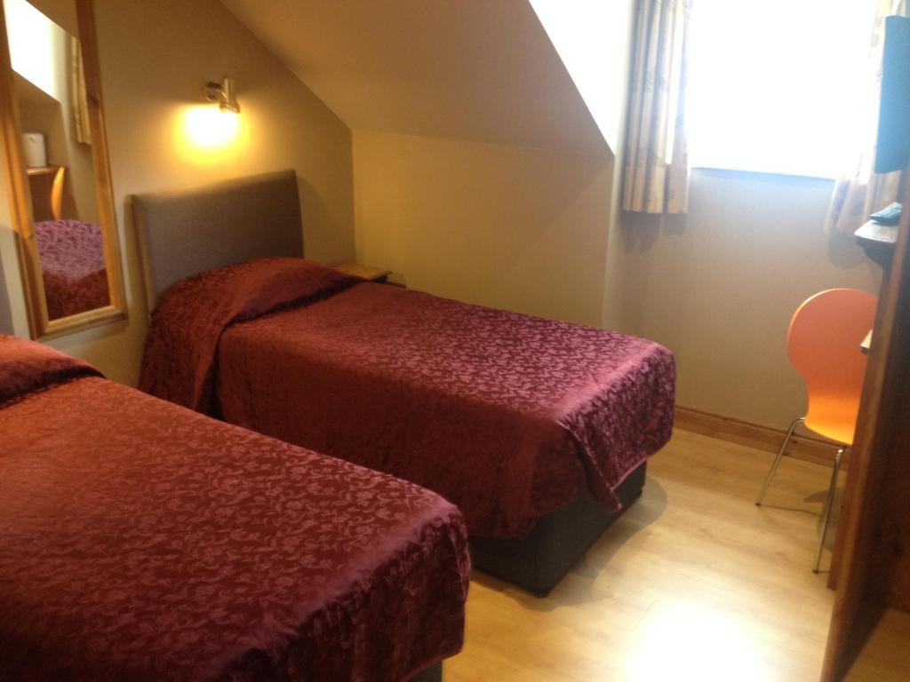Postel nebo postele na pokoji v ubytování Carragh House