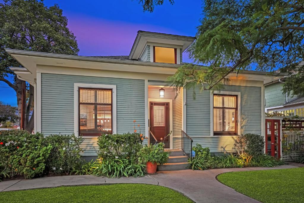 a gray house with a red door at Downtown Villa by Paradise Retreats in Santa Barbara
