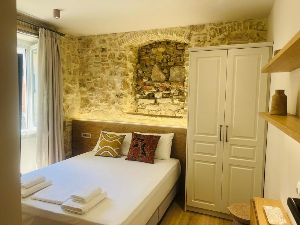 Postel nebo postele na pokoji v ubytování Corcyra Collection