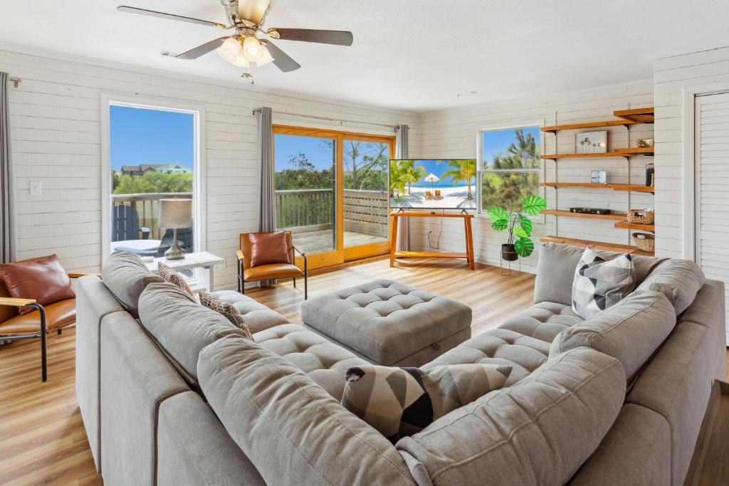 a large living room with a large couch at 8205 - Sea La Vie Salvo in Waves
