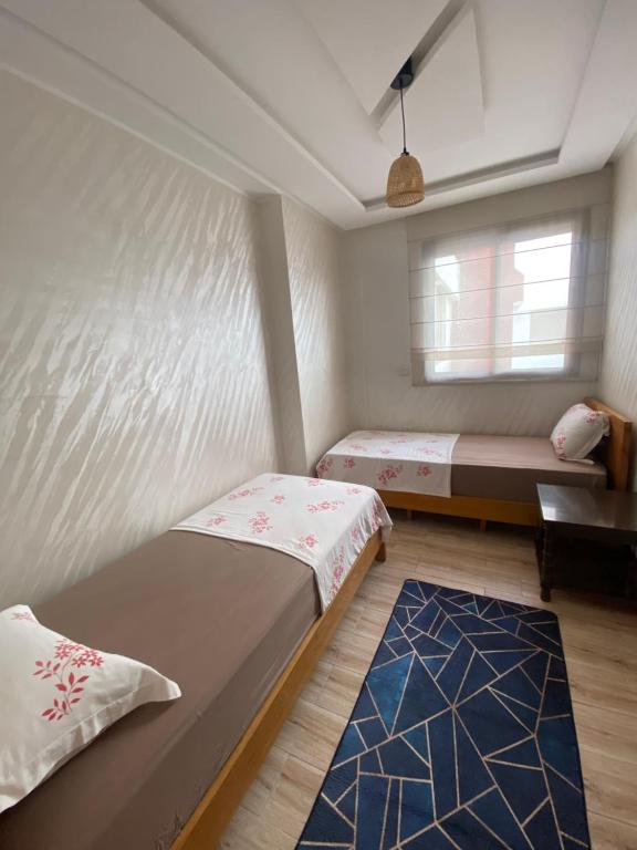 Giường trong phòng chung tại Élégance et Confort à Proximité de la Plage