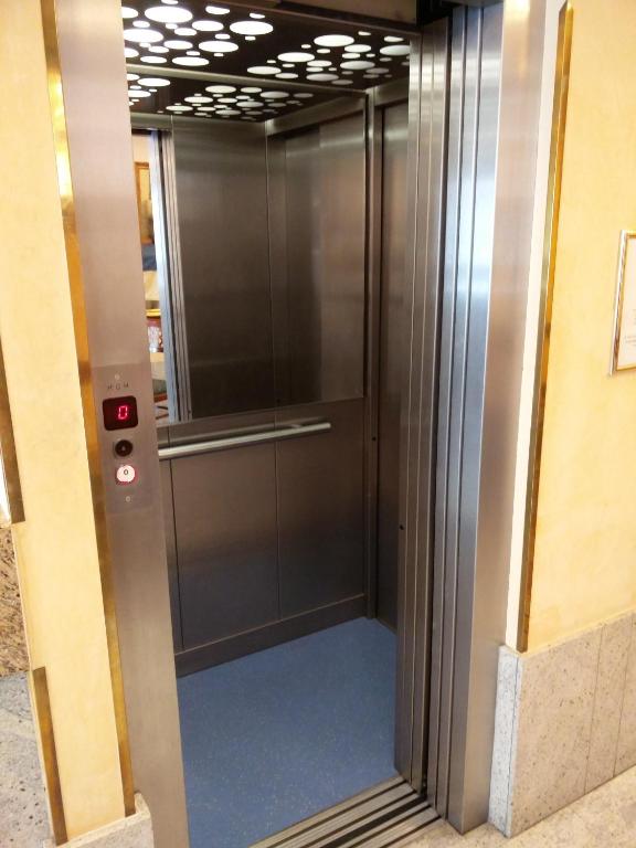 a elevator with a glass door in a building at Hotel Ca&#39; Formenta in Venice