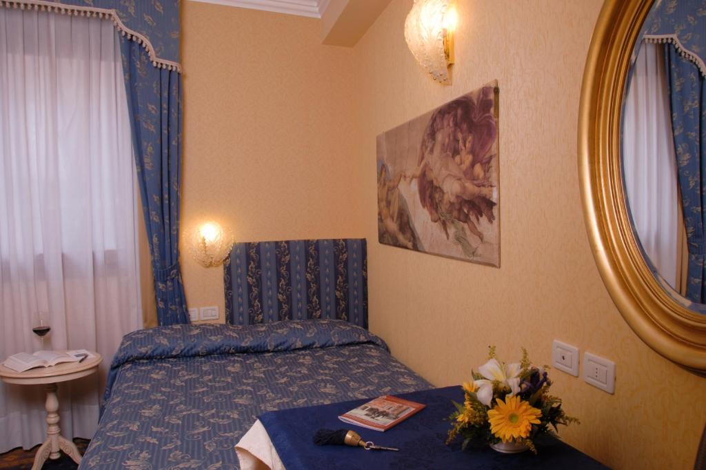 Voodi või voodid majutusasutuse Hotel Ca' Formenta toas