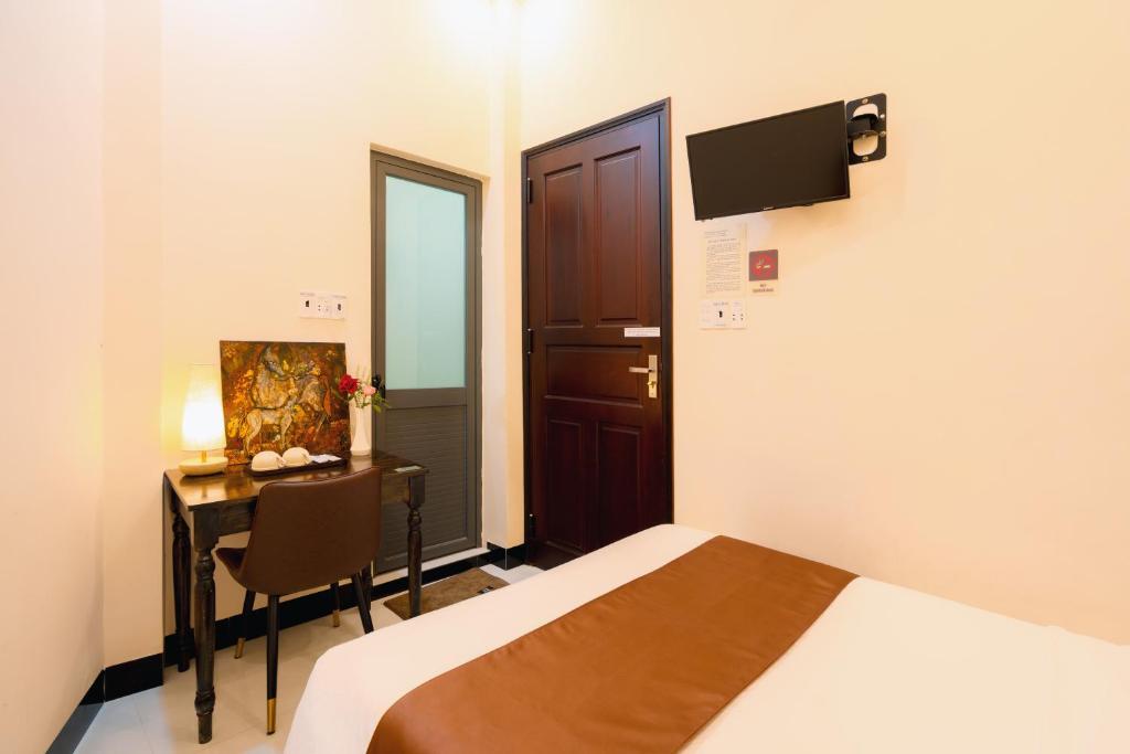 Postel nebo postele na pokoji v ubytování APT Hotel Phan Rang