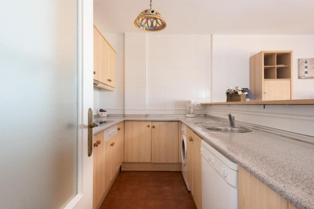 a kitchen with a sink and a counter top at Apartamento Lance Playa in Tarifa