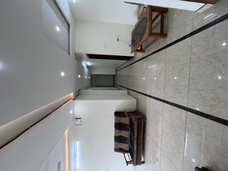 a small bathroom with a sink and a towel at Sln Homes in Bengaluru