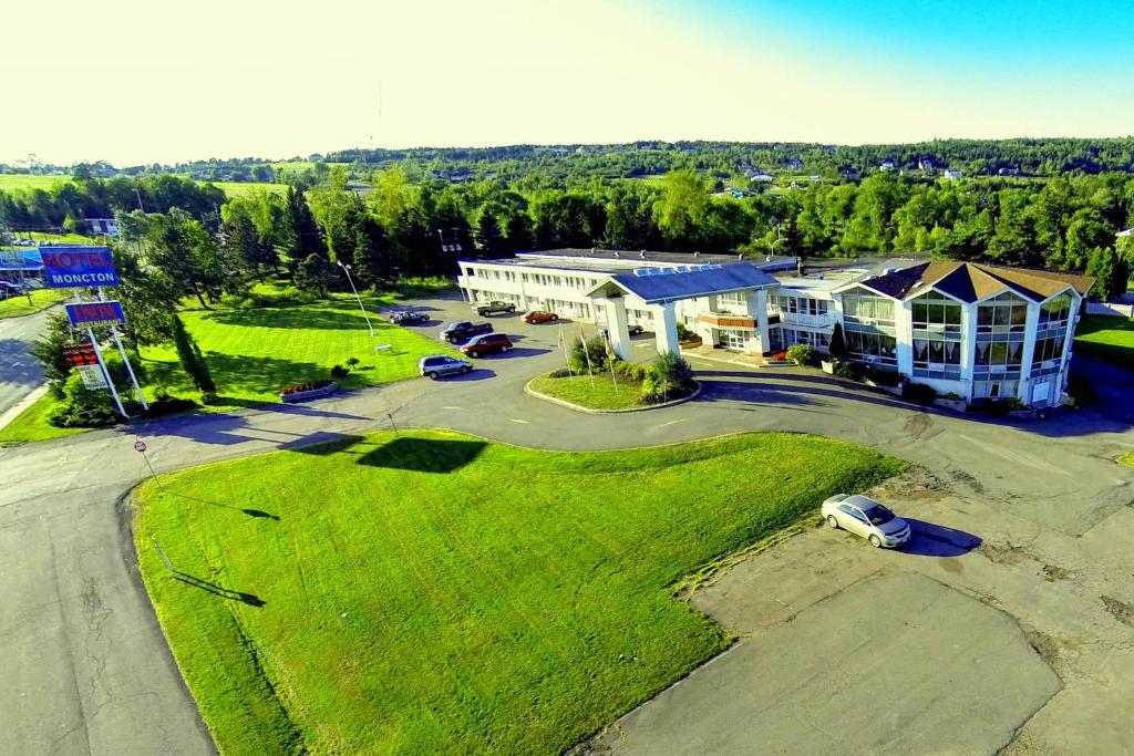 an aerial view of a large building with a parking lot at Hotel Moncton in Moncton