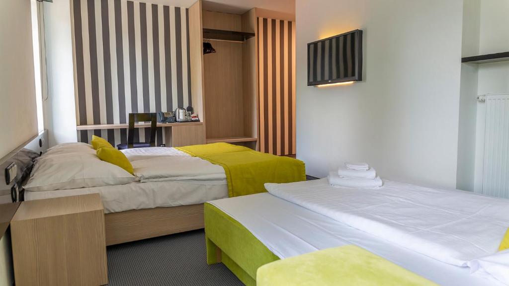 Postel nebo postele na pokoji v ubytování Hotel AquaCity Riverside