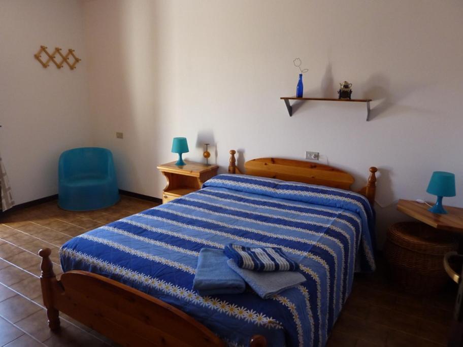 A bed or beds in a room at Piccola Perla A Livo
