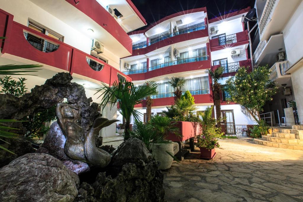 a building with a bunch of plants in front of it at Sirena Marta in Sutomore