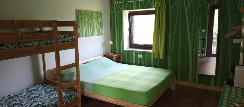 Llit o llits en una habitació de BB6 di Elena e Roberto