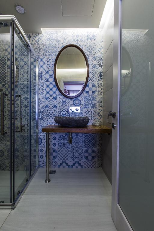 a bathroom with a sink and a mirror at Murella Living in Marsalforn