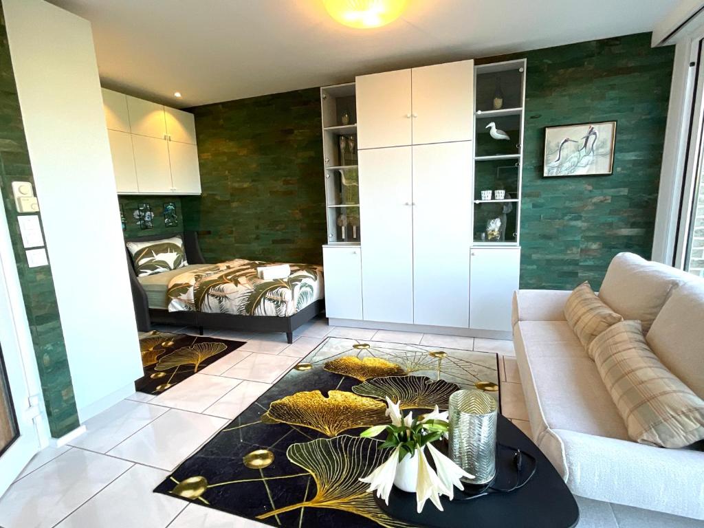 a living room with a couch and a table at Komfortappartement mit Terraasse in Wuppertal