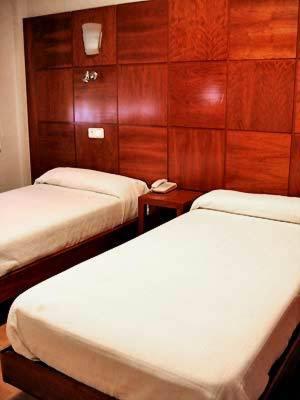 Postel nebo postele na pokoji v ubytování Hotel Trefacio