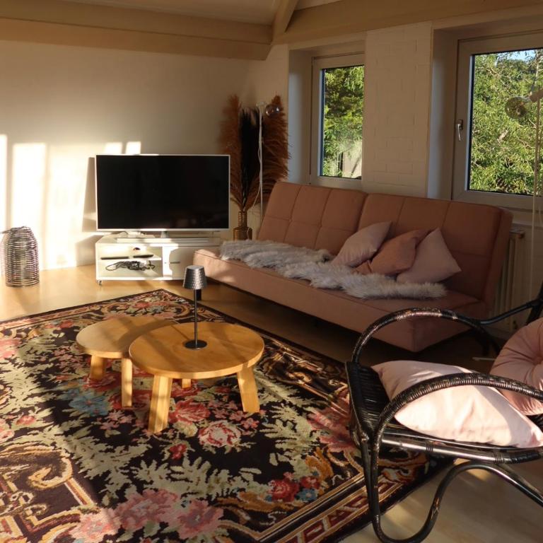 a living room with a couch and a coffee table at Viva la Vida in Bergen