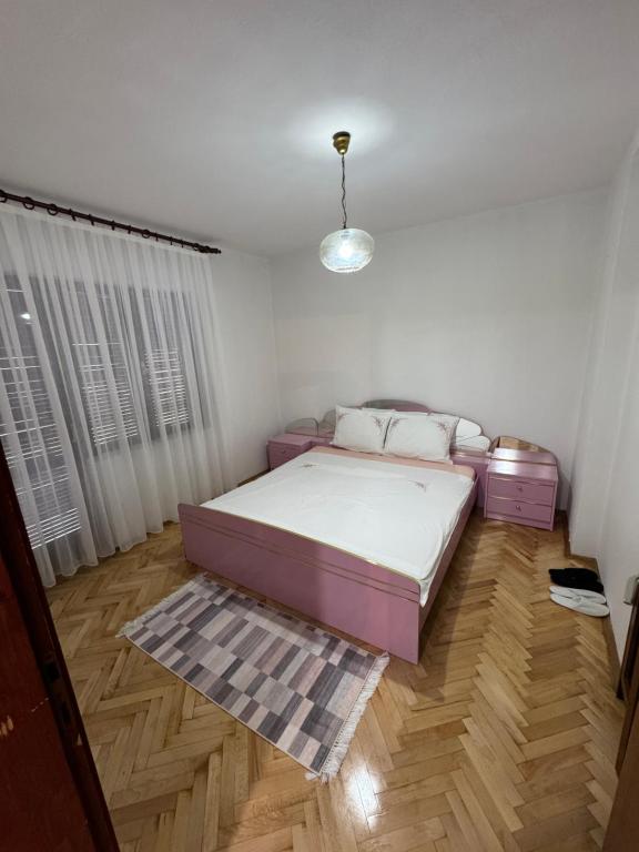 Postel nebo postele na pokoji v ubytování Royal Corner Apartments