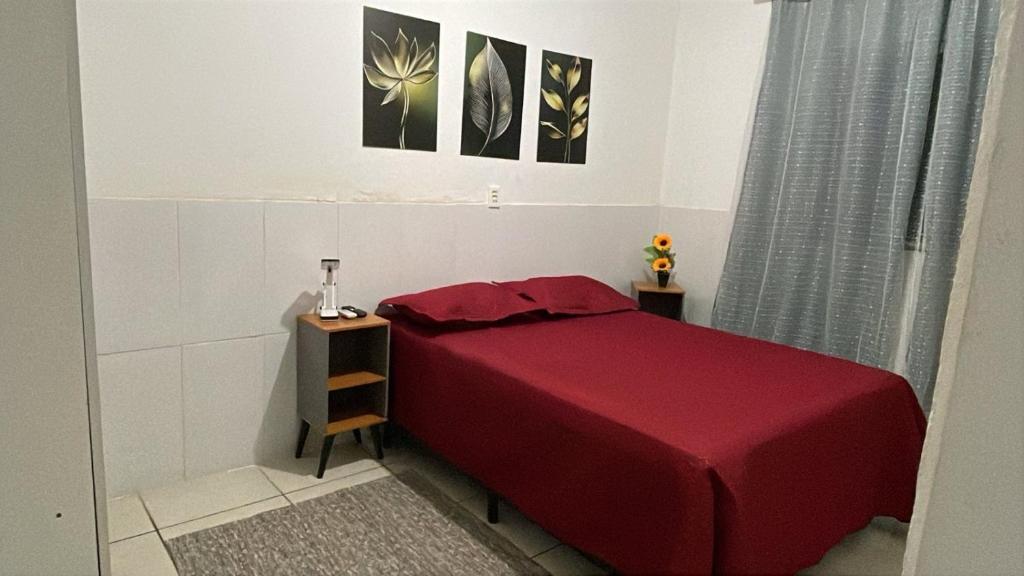 En eller flere senge i et værelse på Minha Casa Seu Lar