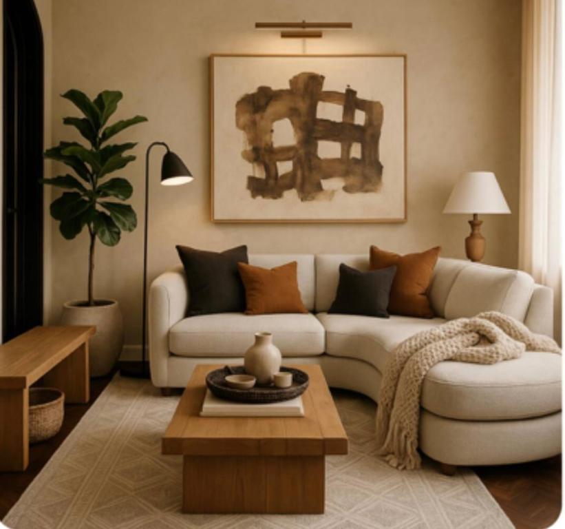 a living room with a white couch and a coffee table at Stay&view Santarém in Santarém