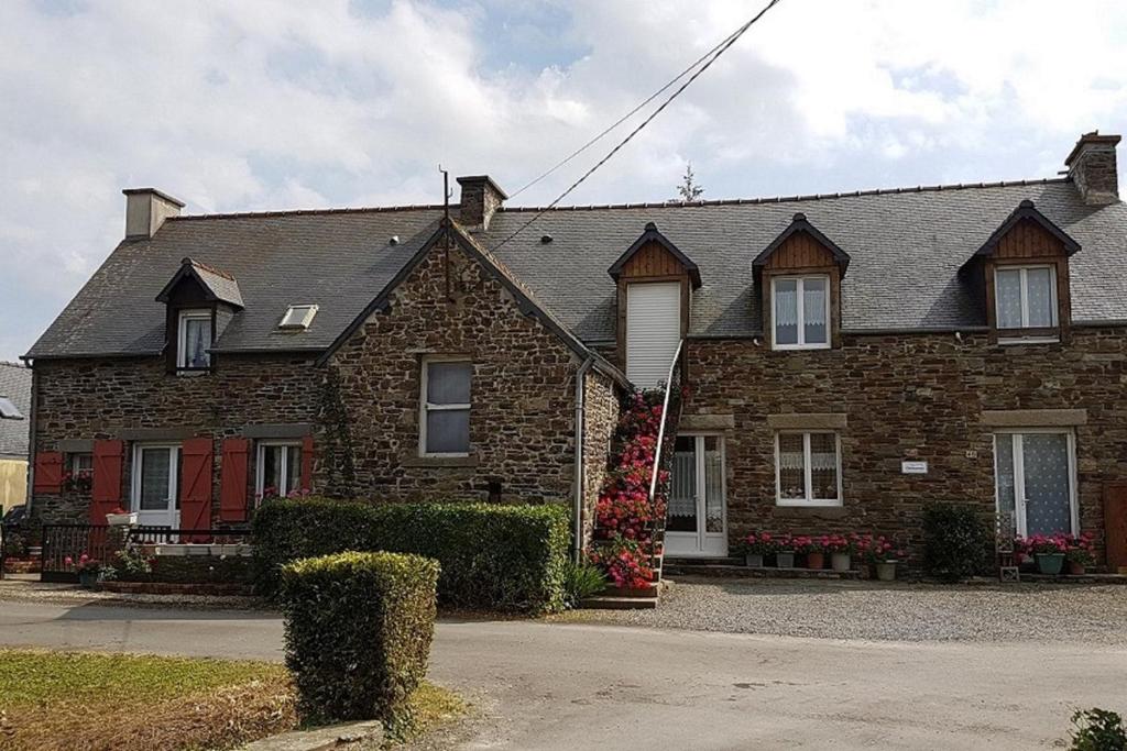 a brick house with a gray roof at Maisons agréables 13ms023 in La Fresnais